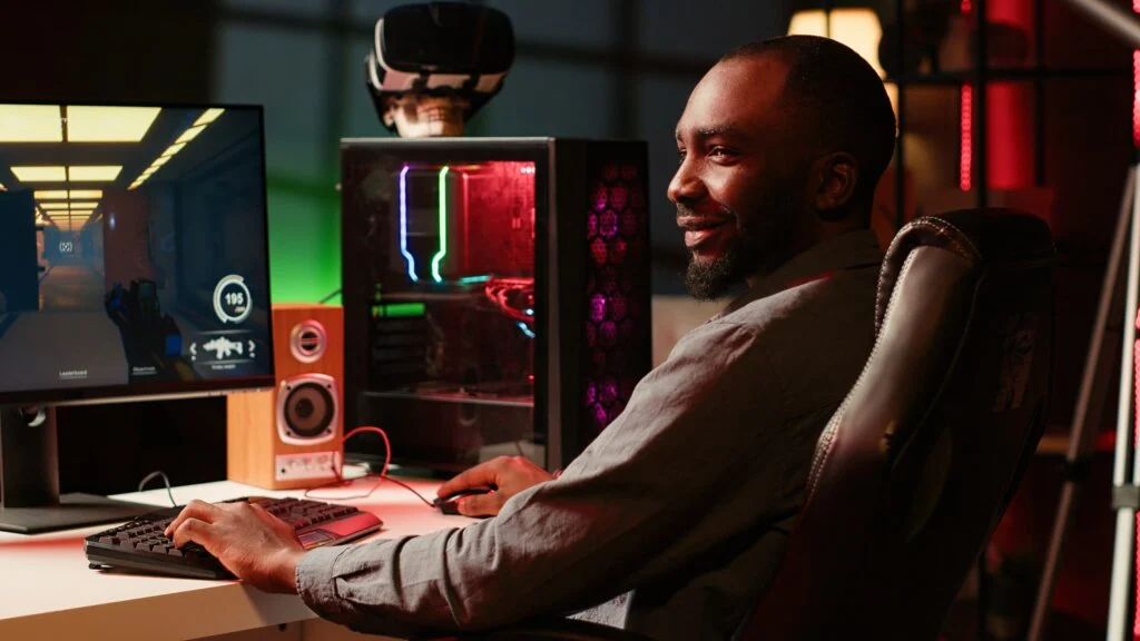 Smiling man playing video game, enjoying day off