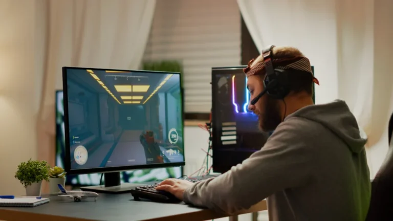 Cyber sport gamer wearing headphones playing first person shooter videogame